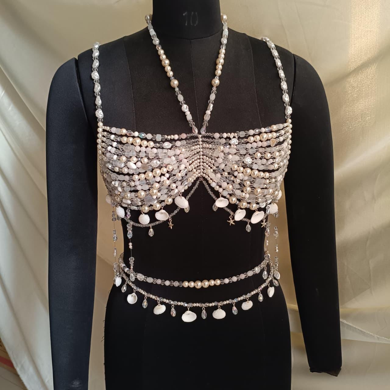 Full view of pearl beaded bralette necklace worn on mannequin, statement body jewelry for bridal and festival outfits