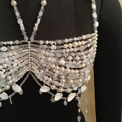 Close up of pearl and crystal beaded bralette necklace showing intricate hand-strung details and shell charm accents