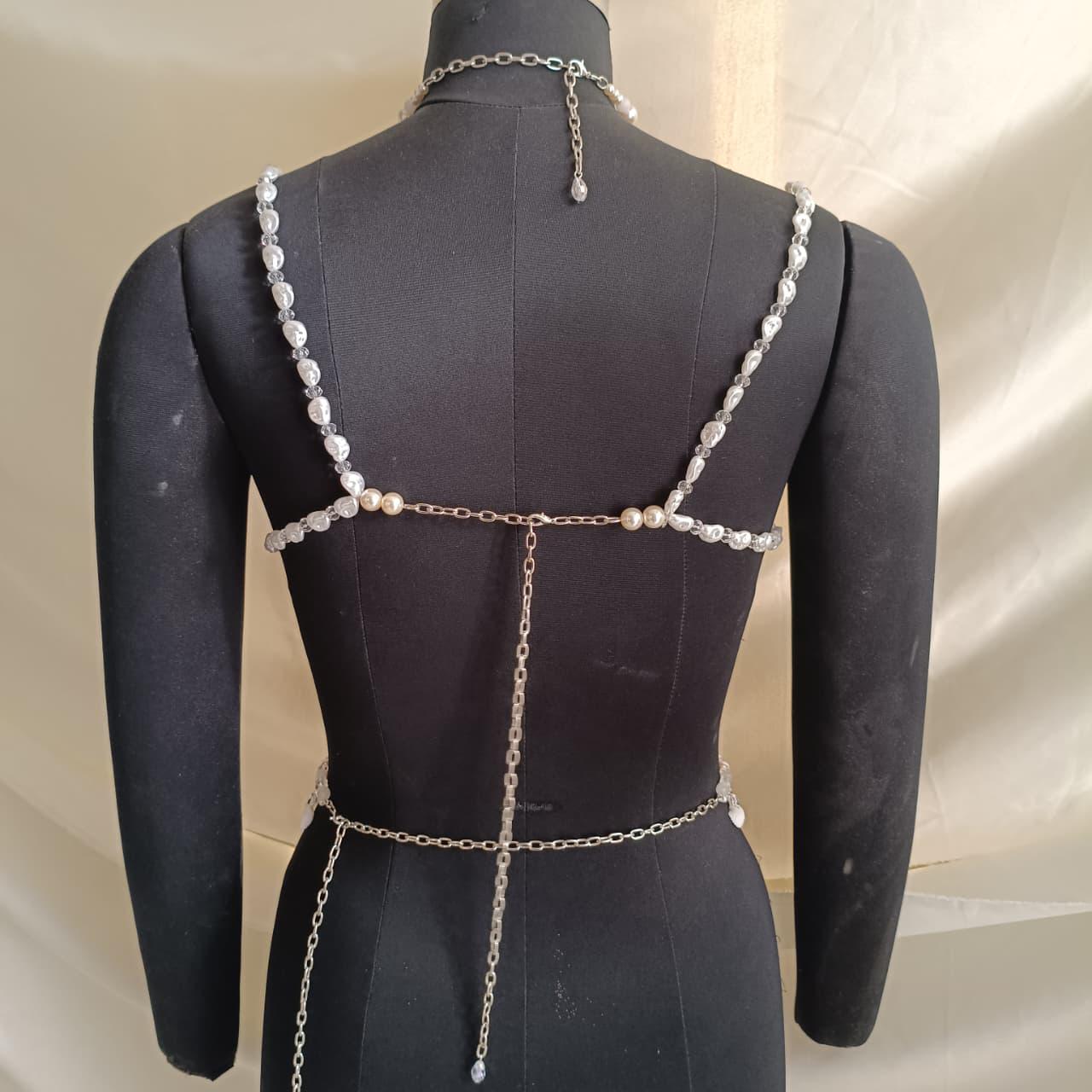 Adjustable tie back and neck closure of pearl bralette necklace ensuring flexible and comfortable fit